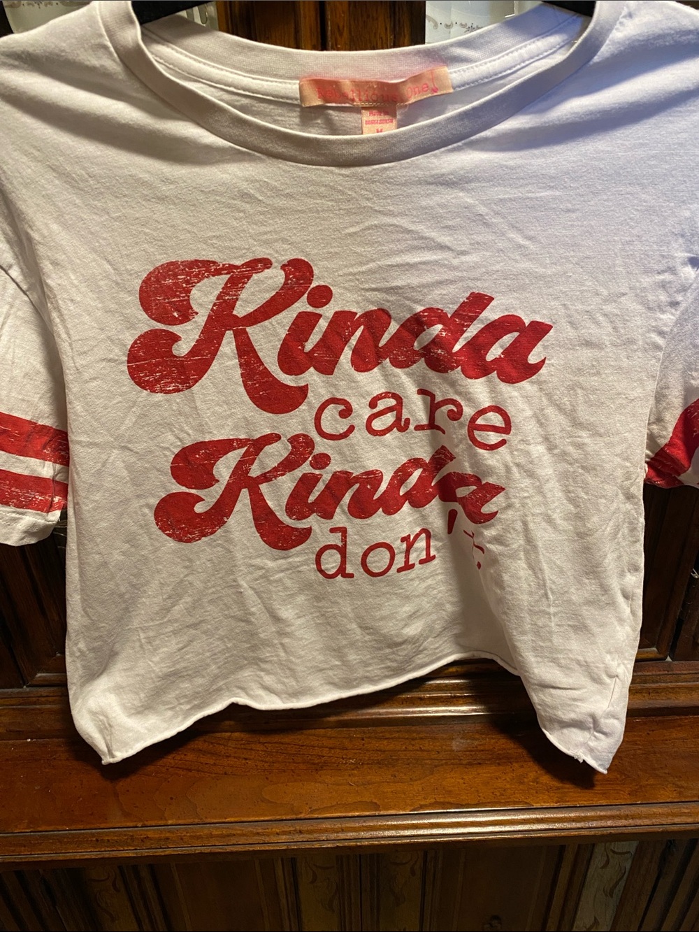 Rebellious One White Crop Top with Red Graphic "Kinda Care Kinda Don't"